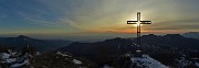 70 La bella croce di vetta Cornagera (1311 m) baciata dal sole con vista verso Val Seriana